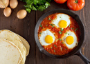 Shakshuka With Eggs, Tomato and Parsley