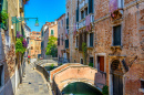 Narrow Canal with Bridges in Venice